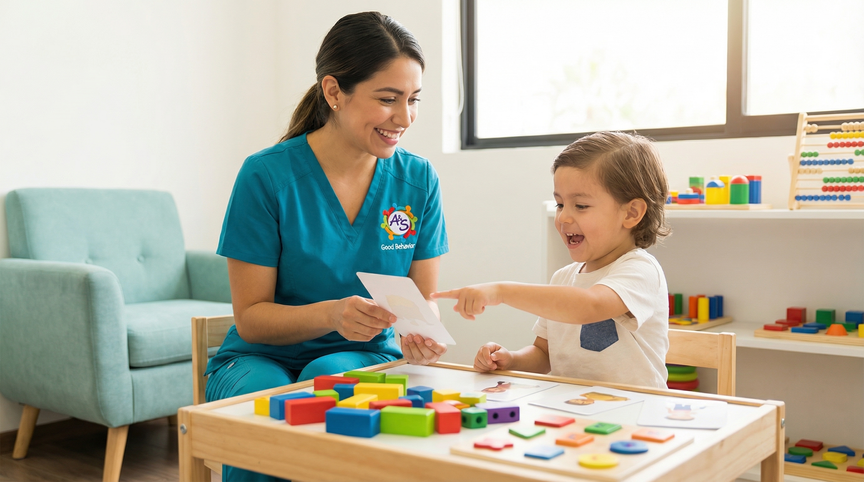 ABA therapist working one-on-one with a child using flashcards